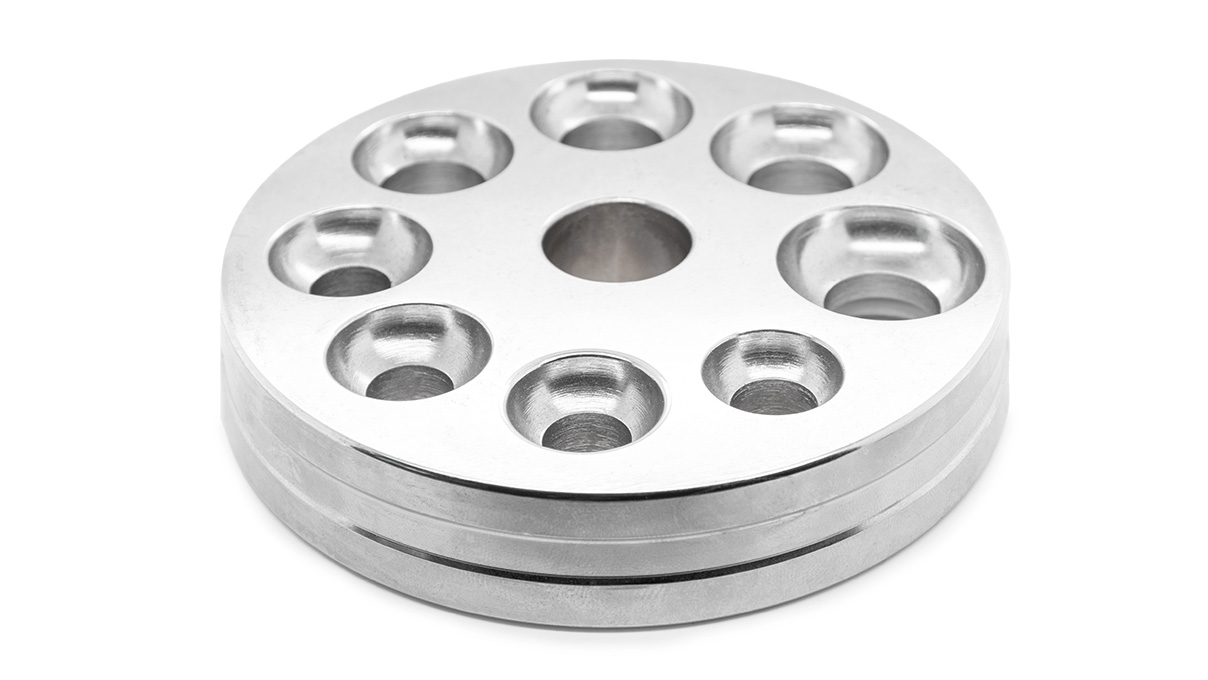 Plaque de matriçage réversible pour machine à changer la taille des bagues